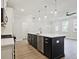 Bright kitchen island with stainless steel appliances and modern pendant lighting, and spacious layout at 158 Bluffington Way, Marietta, GA 30066