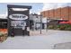 Outdoor area of Truck & Tap features seating, advertising and shady retreat at 1800 Jordan Brook Dr, Lawrenceville, GA 30043