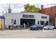 Exterior of Magazzino Deli & Pizza with outdoor seating and street parking at 1800 Jordan Brook Dr, Lawrenceville, GA 30043