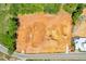 A top-down aerial image of a large construction area with nearby streets and some trees around the perimeter at 407 Thunder Rd, Buford, GA 30518