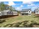 Spacious backyard with new construction home and lush green lawn at 407 Thunder Rd, Buford, GA 30518