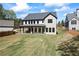 New construction home features a large backyard, patio and lush green lawn at 407 Thunder Rd, Buford, GA 30518