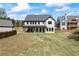 New construction home features a large backyard, patio and lush green lawn at 407 Thunder Rd, Buford, GA 30518