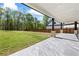 Large backyard with covered patio and expansive green lawn perfect for outdoor activities at 407 Thunder Rd, Buford, GA 30518