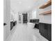 Modern bathroom showcasing a soaking tub, glass enclosed shower, and dual vanities with marble accents at 407 Thunder Rd, Buford, GA 30518
