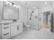Modern bathroom with glass shower, stylish vanity, and tile flooring at 407 Thunder Rd, Buford, GA 30518