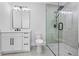 Modern bathroom with glass shower, sleek vanity, and stylish fixtures at 407 Thunder Rd, Buford, GA 30518