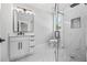 Modern bathroom featuring glass shower and marble countertops at 407 Thunder Rd, Buford, GA 30518