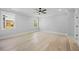 Spacious bedroom features hardwood floors, recessed lighting, and a ceiling fan at 407 Thunder Rd, Buford, GA 30518