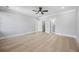 Bright bedroom with hardwood floors, and view to walk-in closet and bathroom at 407 Thunder Rd, Buford, GA 30518