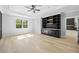 This bedroom has a built-in unit with shelving and cabinets along with ample natural light at 407 Thunder Rd, Buford, GA 30518