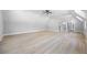 Large bonus room with recessed lights, hardwood floors, and high ceilings at 407 Thunder Rd, Buford, GA 30518