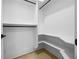 Walk-in closet with custom shelving and hardwood floors at 407 Thunder Rd, Buford, GA 30518