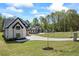 Scenic view showcasing the home's exterior, landscaping, and surrounding neighborhood at 407 Thunder Rd, Buford, GA 30518