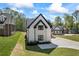 Side angle view of the home, highlighting the modern design and manicured lawn at 407 Thunder Rd, Buford, GA 30518
