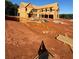 Exterior view of new home under construction showcasing framing, windows, and ladder at 407 Thunder Rd, Buford, GA 30518