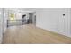 Bright hallway with hardwood floors, decorative wall trim, iron railing and elegant chandelier at 407 Thunder Rd, Buford, GA 30518