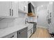 Modern kitchen design with stainless steel appliances and elegant countertop at 407 Thunder Rd, Buford, GA 30518