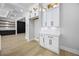 Bright kitchen with ample cabinet space, modern design, and wood flooring at 407 Thunder Rd, Buford, GA 30518