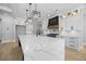 Bright kitchen features white cabinets, marble countertops, and modern pendant lighting at 407 Thunder Rd, Buford, GA 30518