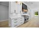 Well-equipped kitchen featuring stainless steel appliances and sleek white cabinetry at 407 Thunder Rd, Buford, GA 30518