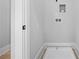 Bright laundry room with connections for a washer and dryer at 407 Thunder Rd, Buford, GA 30518