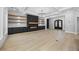 Elegant living room boasts a fireplace feature wall, wood floors, and natural lighting at 407 Thunder Rd, Buford, GA 30518