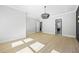 A bright and open living room with hardwood floors and a chandelier, creating a modern and elegant atmosphere at 407 Thunder Rd, Buford, GA 30518
