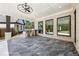 Covered patio with brick columns offers outdoor dining and relaxation area at 407 Thunder Rd, Buford, GA 30518