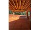 A covered outdoor patio area with a view of the surrounding trees at 407 Thunder Rd, Buford, GA 30518