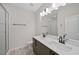Bright bathroom featuring double sink vanity, framed mirror, and a walk-in shower at 1227 Cushenberry Ln, Atlanta, GA 30318