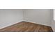Bedroom featuring wood-look floors, white walls, base trim and electrical outlets at 1227 Cushenberry Ln, Atlanta, GA 30318