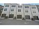 Row of modern townhomes featuring white exteriors and garage doors at 1227 Cushenberry Ln, Atlanta, GA 30318