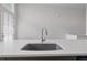 Close-up of kitchen island with stainless steel faucet and sleek countertop design at 1227 Cushenberry Ln, Atlanta, GA 30318