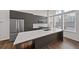 Modern kitchen boasts gray cabinetry, stainless steel appliances, a large island, and bright natural light at 1227 Cushenberry Ln, Atlanta, GA 30318