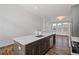 Bright and airy kitchen featuring a large island, stainless steel appliances, and modern finishes at 1227 Cushenberry Ln, Atlanta, GA 30318
