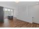 Open living area featuring a kitchen, staircase, and hardwood flooring at 1227 Cushenberry Ln, Atlanta, GA 30318