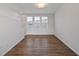 Bright, sunlit living room with modern flooring and neutral wall paint at 1227 Cushenberry Ln, Atlanta, GA 30318