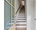A long staircase ascends from the front door, featuring wooden steps and a handrail at 1227 Cushenberry Ln, Atlanta, GA 30318