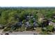 Neighborhood aerial showing lush trees and well-maintained properties, with the city skyline visible in the distance at 1012 Bellevue Ne Dr, Atlanta, GA 30306