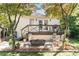 Private backyard oasis with a deck, patio seating, string lights, and mature trees for relaxed outdoor living at 1012 Bellevue Ne Dr, Atlanta, GA 30306