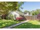 Spacious backyard featuring a stone path, blooming bushes, and mature trees, creating a serene outdoor retreat at 1012 Bellevue Ne Dr, Atlanta, GA 30306