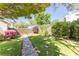 Beautiful backyard with a stone walkway, mature trees, and blooming bushes enhancing the outdoor experience at 1012 Bellevue Ne Dr, Atlanta, GA 30306