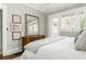 Neutral bedroom with large mirror, light paint, and lots of natural light at 1012 Bellevue Ne Dr, Atlanta, GA 30306