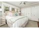 Bedroom with neutral paint, white trim, ceiling fan and a spacious closet at 1012 Bellevue Ne Dr, Atlanta, GA 30306