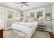 Cozy bedroom features neutral paint, white trim, and lots of natural light at 1012 Bellevue Ne Dr, Atlanta, GA 30306