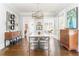 Spacious dining room with hardwood floors, modern chandelier, and decorative chest for a stylish look at 1012 Bellevue Ne Dr, Atlanta, GA 30306