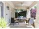 Inviting front porch with comfortable seating, a porch swing, and stylish decor, great for relaxing and entertaining guests at 1012 Bellevue Ne Dr, Atlanta, GA 30306