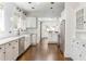 Bright kitchen features white cabinets, stainless steel appliances, subway tile backsplash, and hardwood floors at 1012 Bellevue Ne Dr, Atlanta, GA 30306