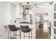 Eat-in kitchen with breakfast bar, subway tile backsplash, stainless appliances, and hardwood floors at 1012 Bellevue Ne Dr, Atlanta, GA 30306